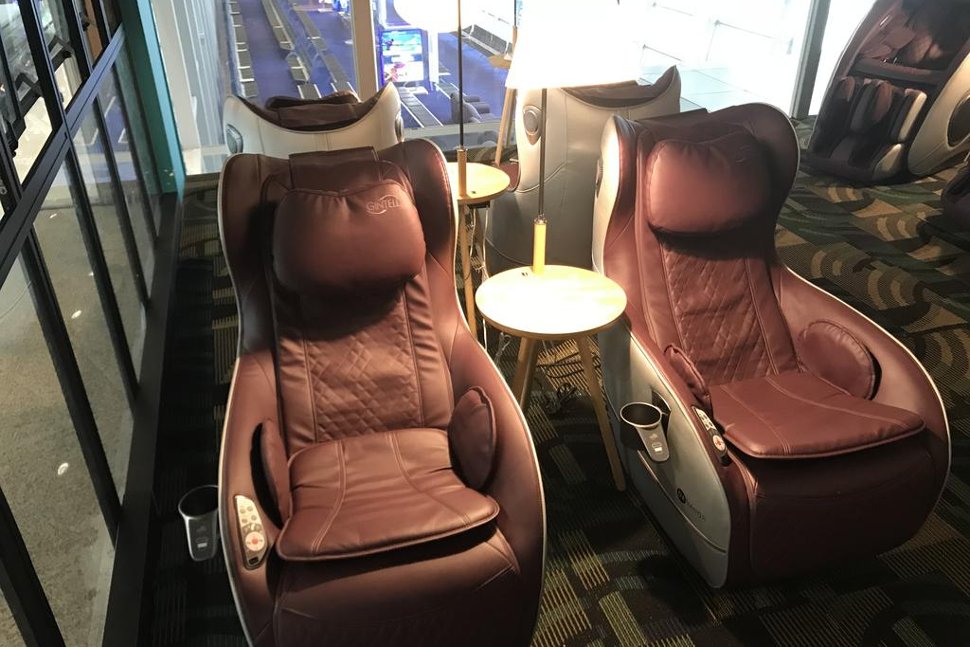 Recharge yourself at the comfortable massage chair before your flight