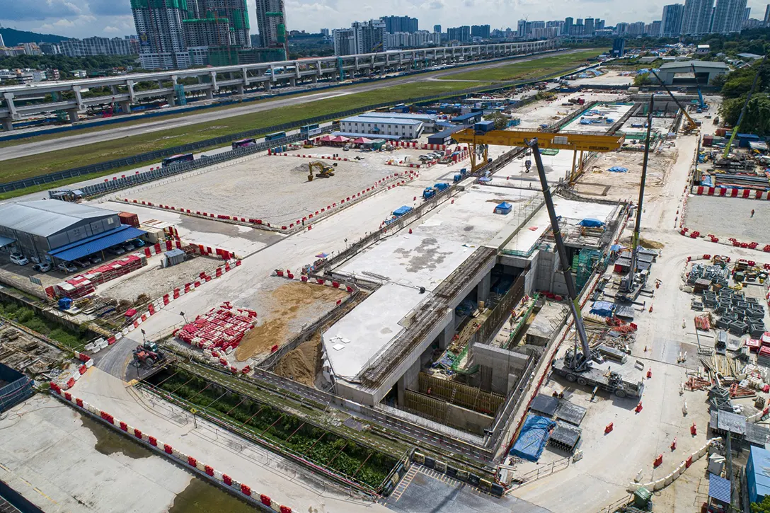 Aerial view of the Bandar Malaysia Utara MRT Station showing the construction progress of roof slab, reinforced wall, column, backfilling works and laying the waterproofing.