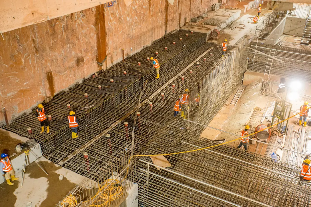 View of the KLCC East MRT Station site showing the progress of upper under platform slab and waler beam reinforcement bar installation.
