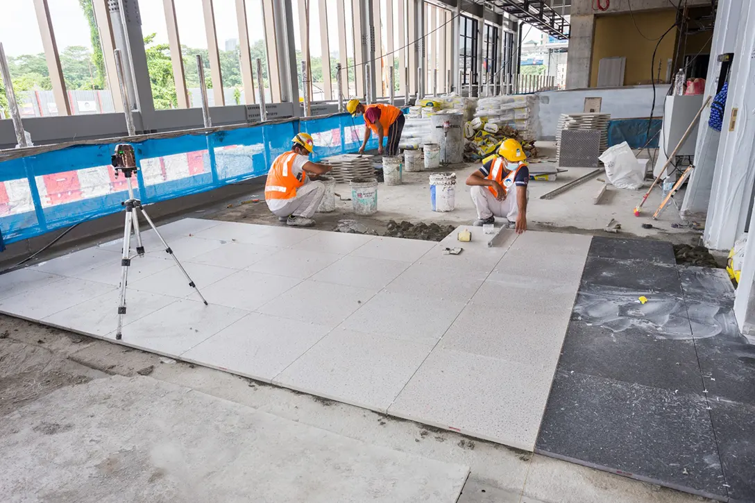 View of the Jalan Ipoh MRT Station concourse level showing the tiling works in progress.