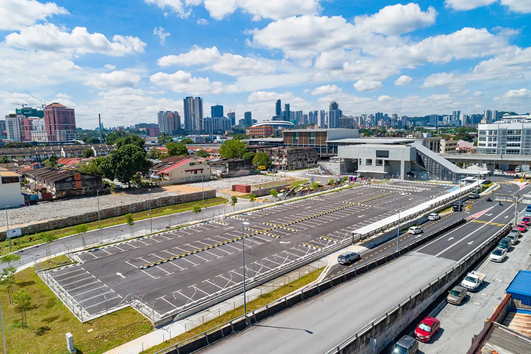 Aerial view of the Kentonmen MRT Station at-grade park and ride showing the final layer of Asphalt Concrete Wearing Course (ACWC) completed