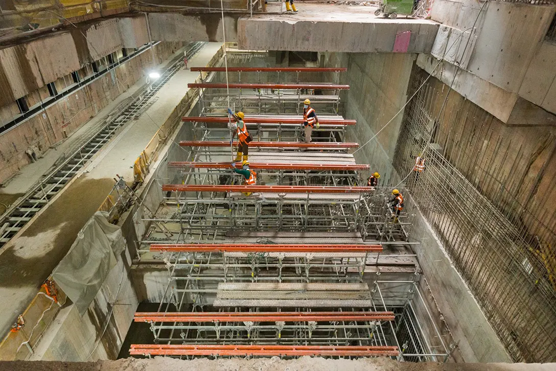 Formwork installation for staircase from concourse to lower platform levels in progress at the Persiaran KLCC MRT Station.