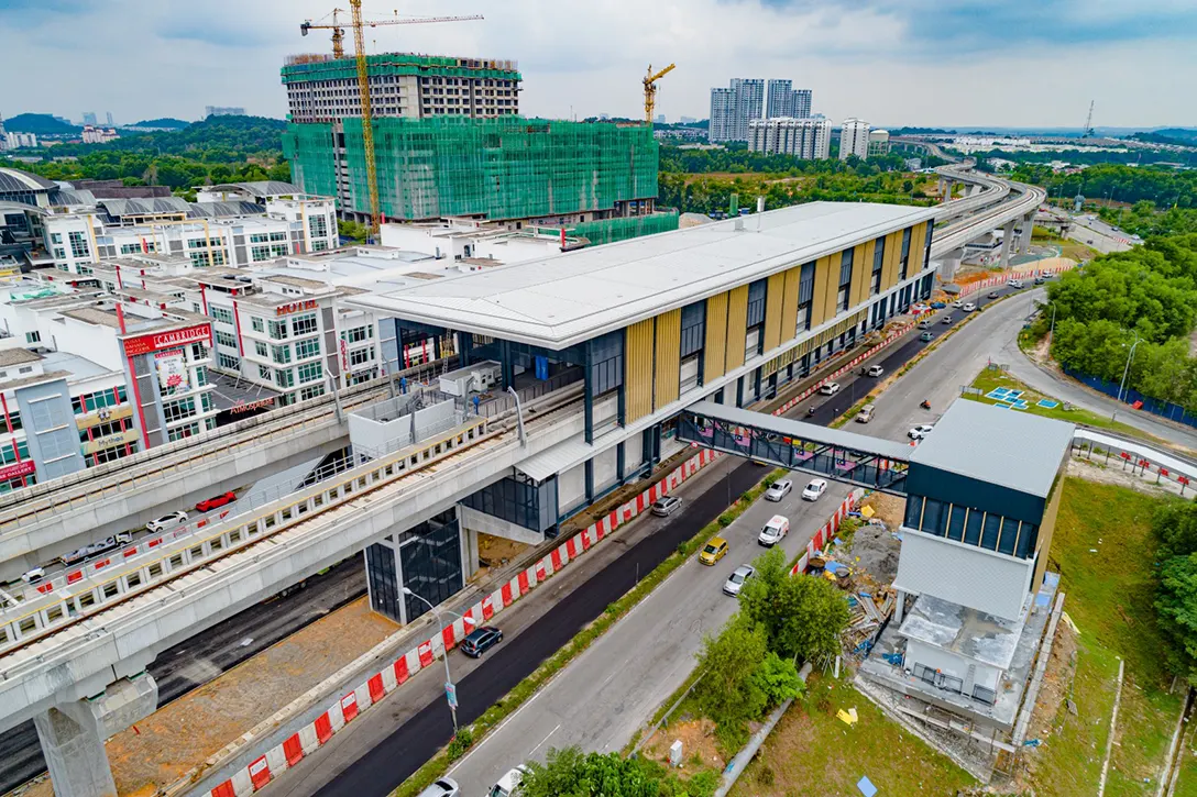 Aerial view of the Putra Permai MRT Station showing the final architectural finishing touches in progress.