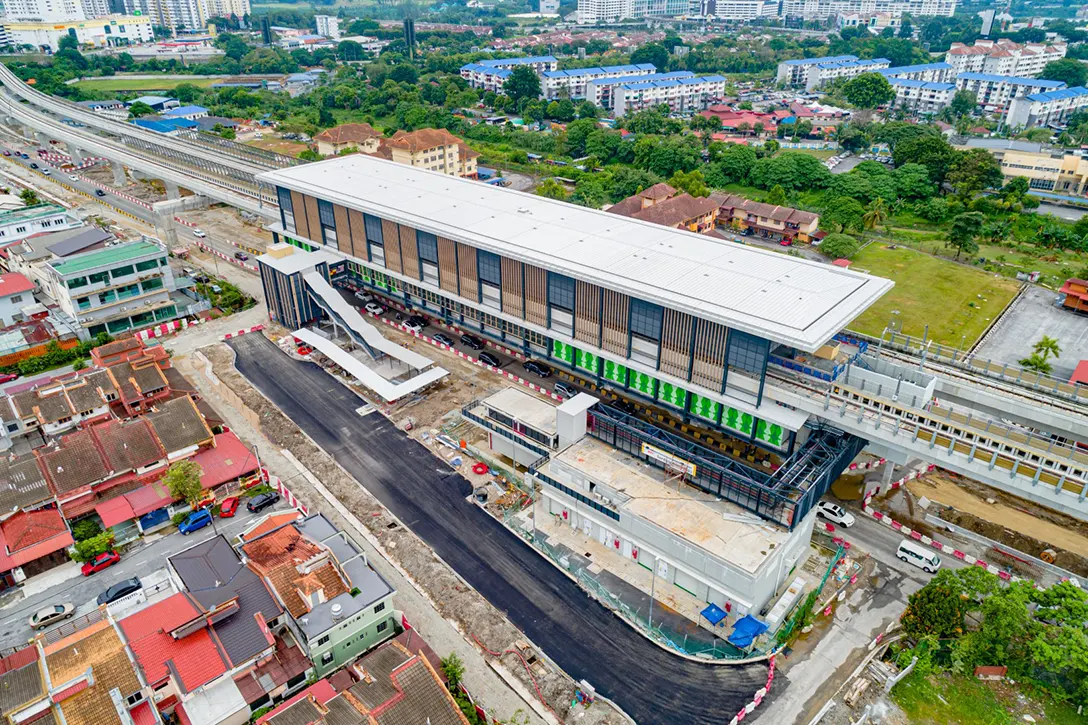 Aerial view of the Serdang Jaya MRT Station showing the road premix and at grade noise barrier works in progress.