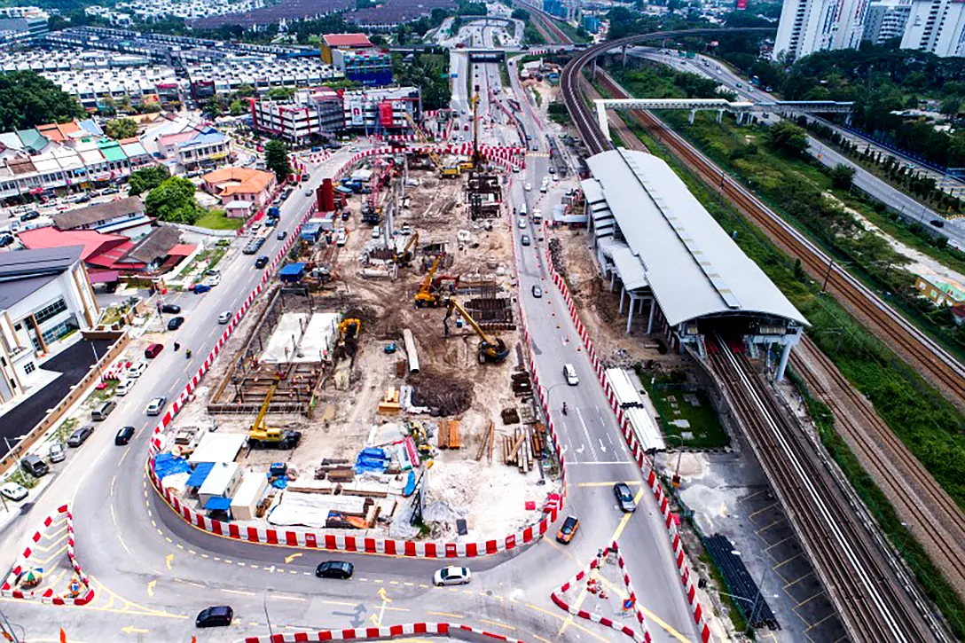 Aerial view of ongoing construction works for station shear wall, perimeter wall, ground beam and pile cap at the Sungai Besi MRT Station site.