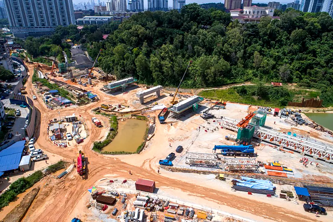 Aerial view of the portal beam works and erection of launching gantry at the Taman Naga Emas MRT Station site.