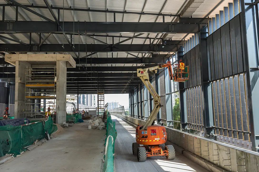 View of inside the Taman Naga Emas MRT Station showing the installation of façade cladding in progress.