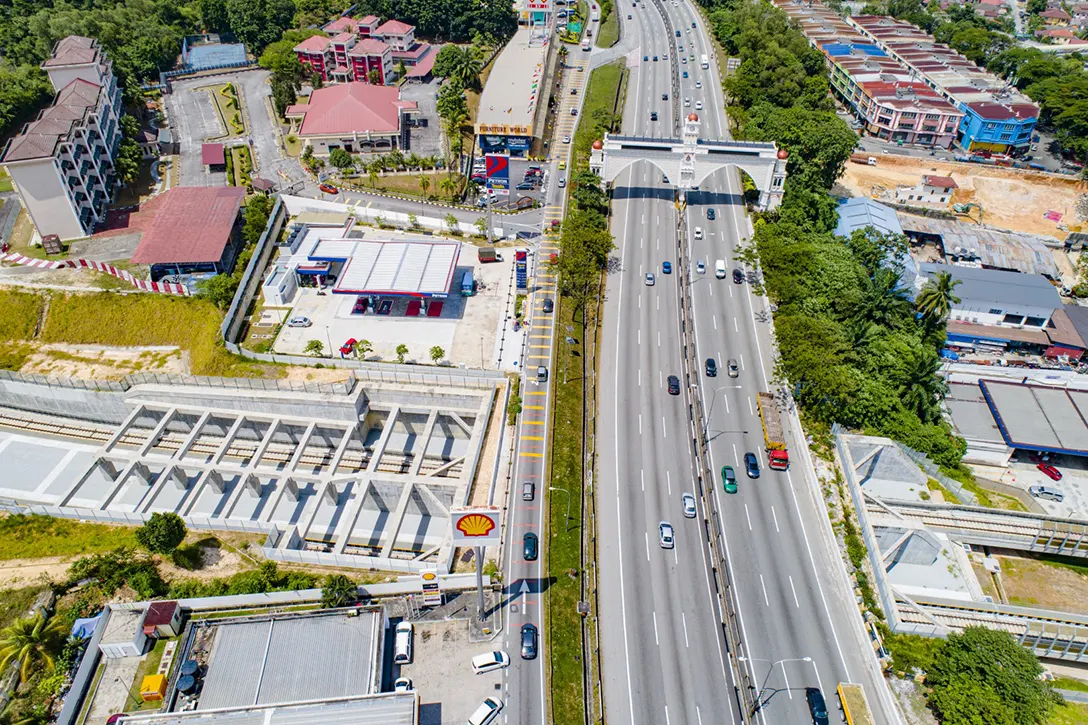 Aerial view of the underpass near KL-Seremban Highway showing the underpass crossing underneath the highway completed.