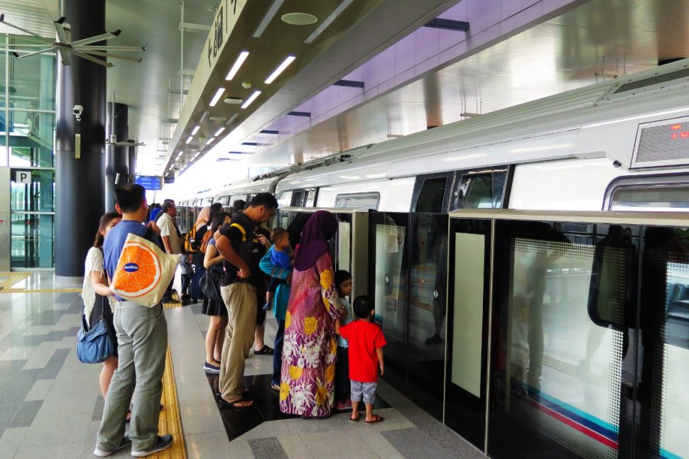 Commuters boarding the MRT train at Semantan station