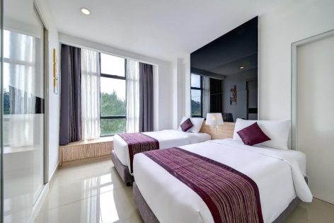 Room features 2 single beds