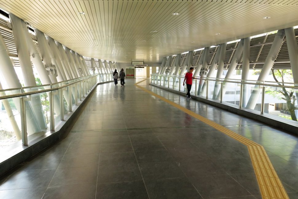Pedestrian link bridges connecting the entrances of the station with neighboring buildings