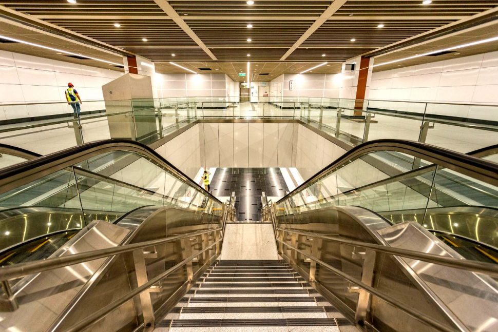 Escalator and stair access to the boarding platforms