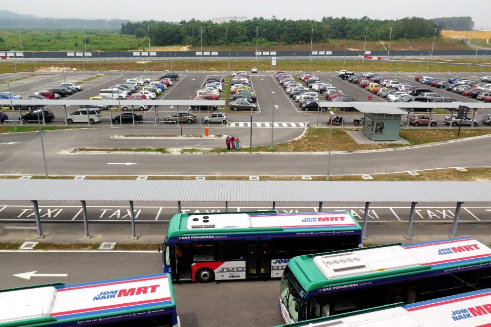 Buses and cars parking at Kwasa Sentra station's park and ride area