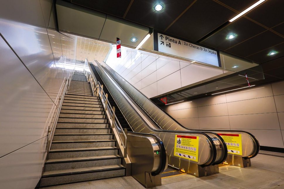 Escalators and stair for access to the ground level, heading towards Entrance A