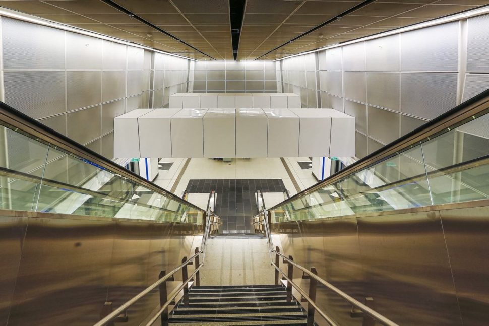 Staircase and escalator access to the train boarding platforms