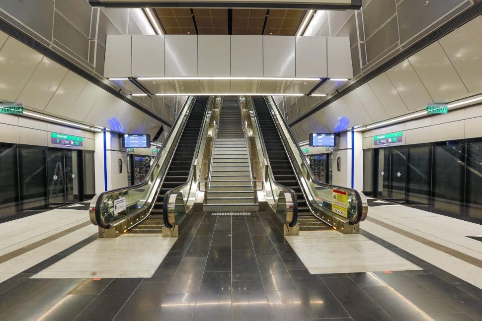 Staircase and escalator access to the train boarding platforms