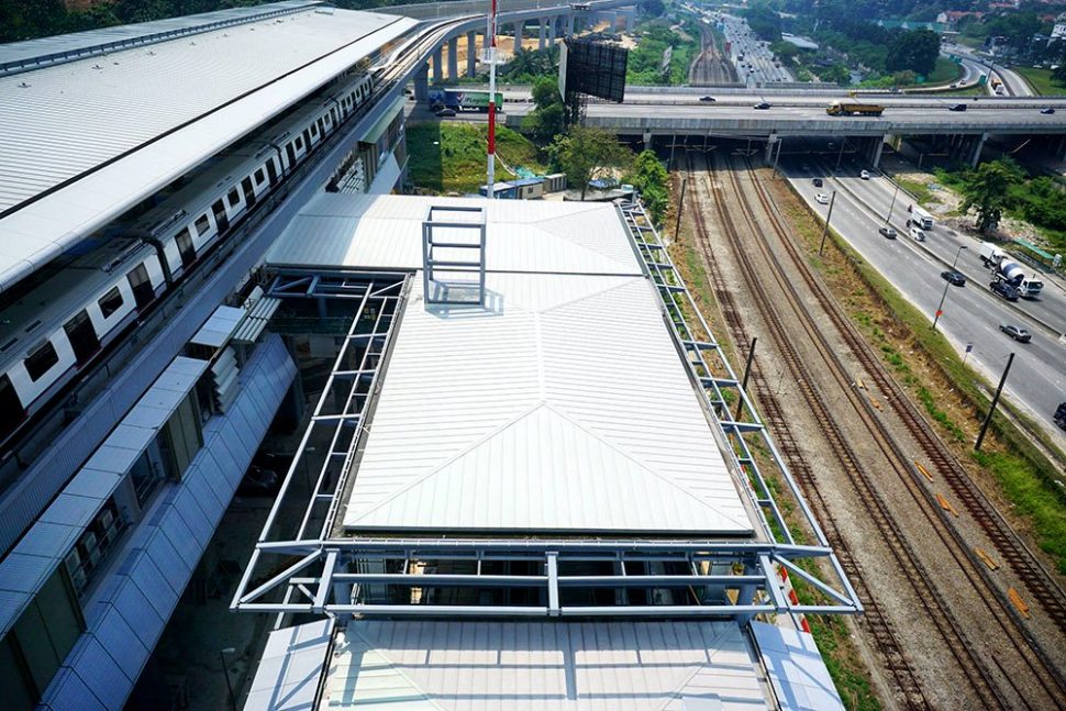 View of the Sungai Buloh MRT Station (left) located next to the KTM train tracks (right). Apr 2016