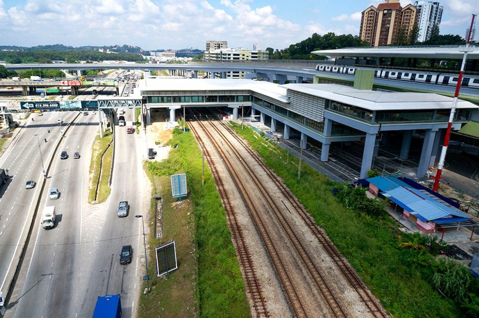 View of the completed Sungai Buloh MRT Station with the common concourse with the Sungai Buloh KTM Station over the KTM tracks. Also seen is an MRT train undergoing testing. Nov 2016