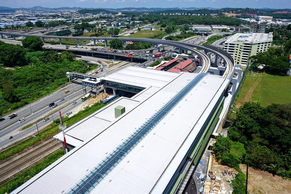 View of the Sungai Buloh MRT Station (white roof) with the common concourse with the Sungai Buloh KTM Station (red roof). Sep 2016