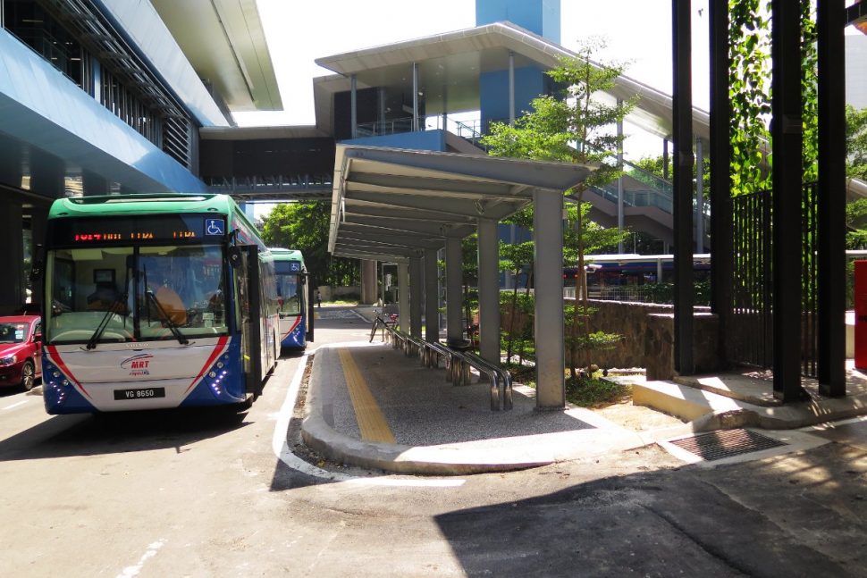 Shuttle bus waiting at bus stop near entrance A