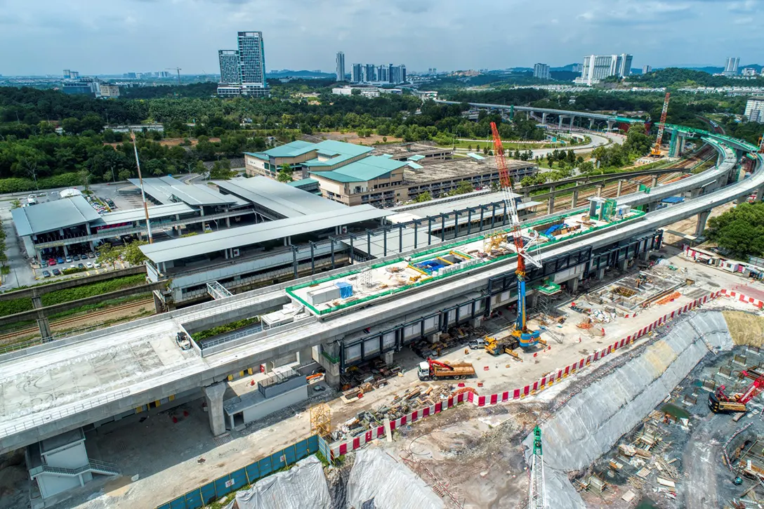 Aerial view of the Putrajaya Sentral MRT Station site showing the steel structure erection in progress.