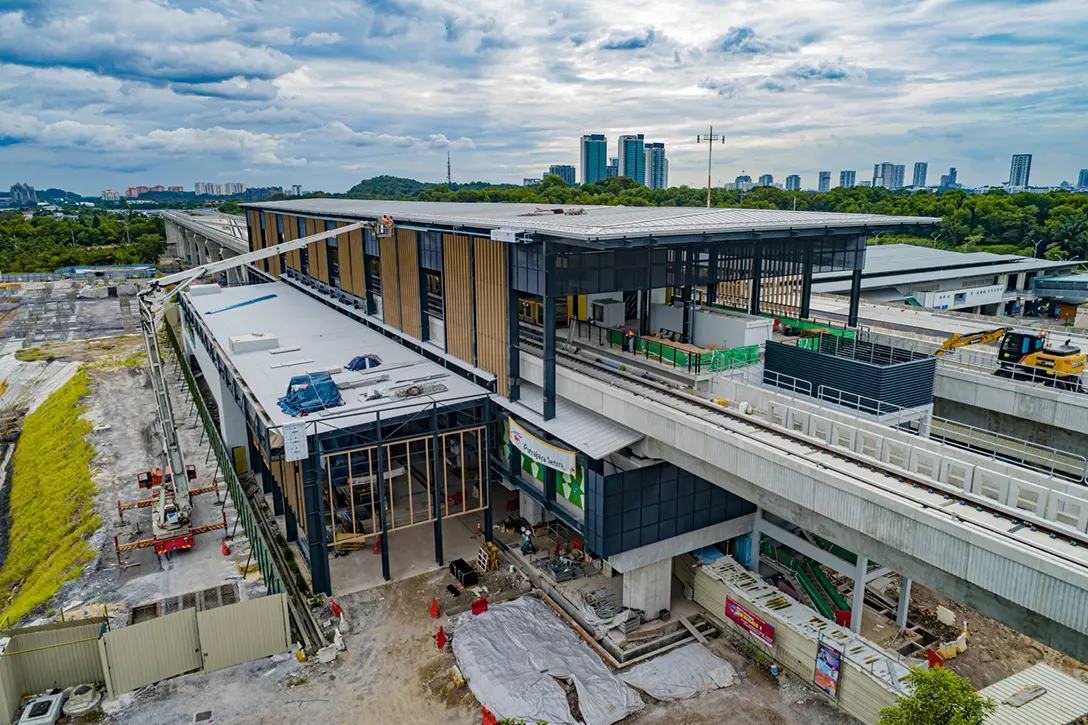 Aerial view of the Putrajaya Sentral MRT Station showing the installation of roof aluminium composite panel and entrance façade works in progress.