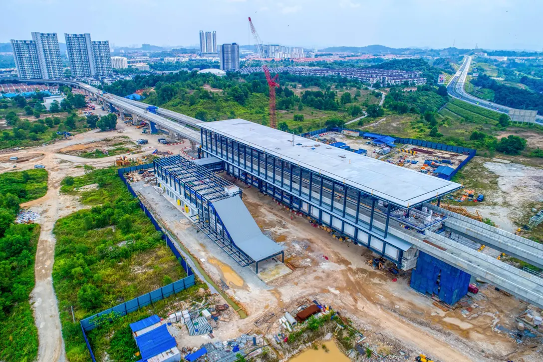 Aerial view of the 16 Sierra MRT Station site showing the final layer and Entrance 2 roof covering installations in progress.