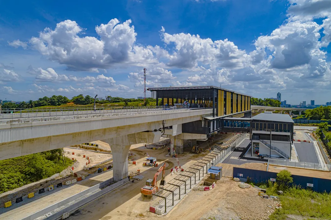 Aerial view of the 16 Sierra MRT Station showing the station external works such as covered walkway, fencing, drainage and roadworks in progress.
