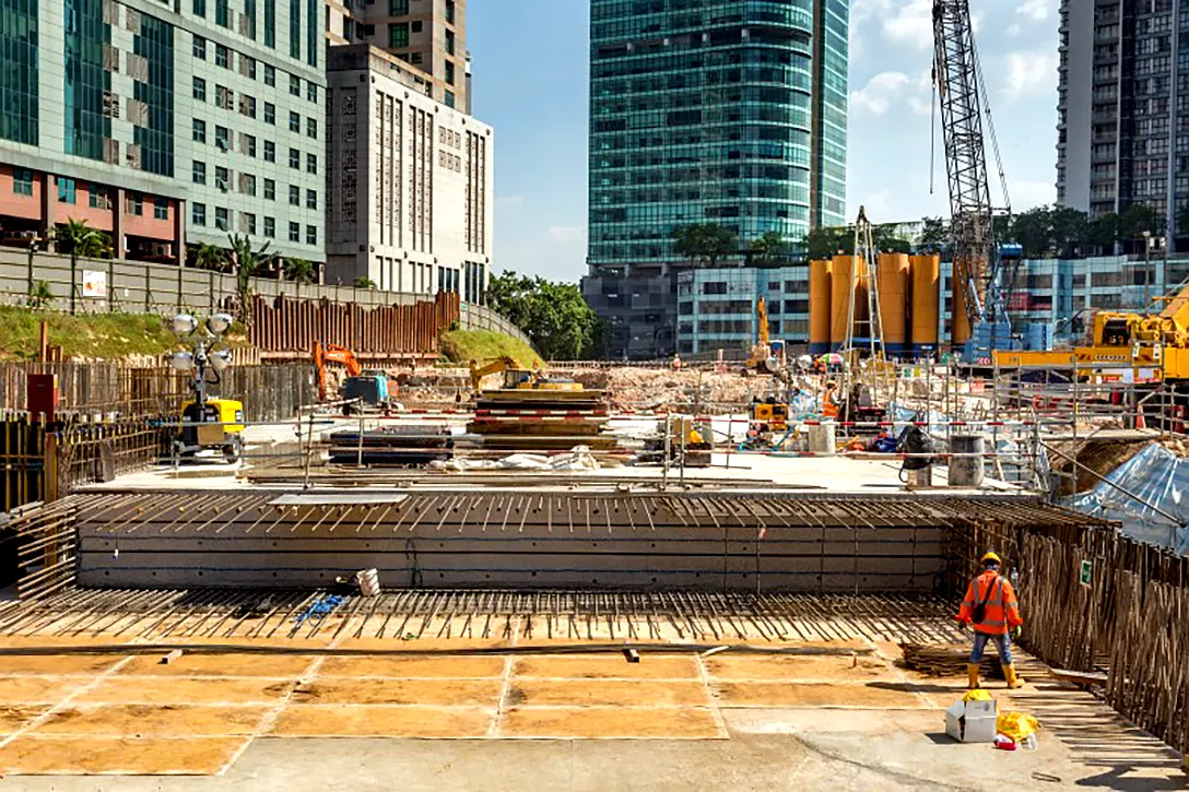 Roof slab and bore pile construction at the Ampang Park MRT Station site.