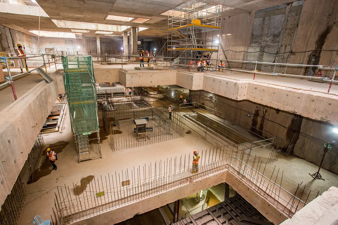 View of the construction of reinforced concrete non-load bearing walls at the Ampang Park MRT Station lower concourse level.