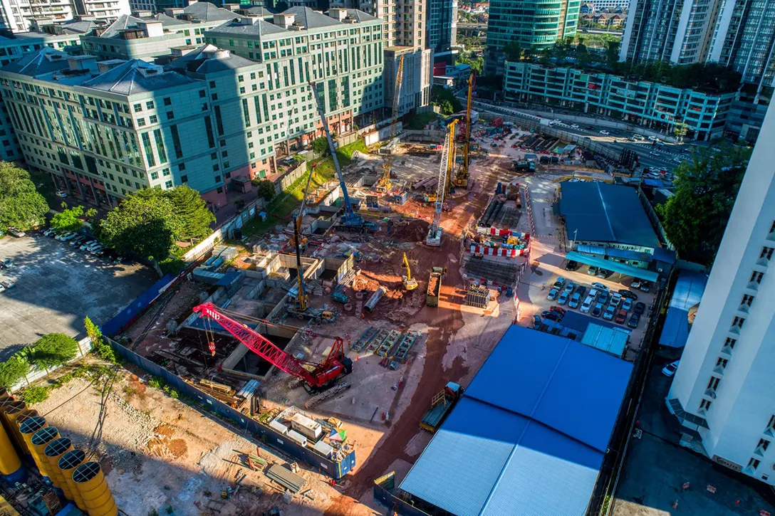 Aerial view of the Ampang Park MRT Station with ongoing reinforced concrete internal wall works, screeding and painting works.