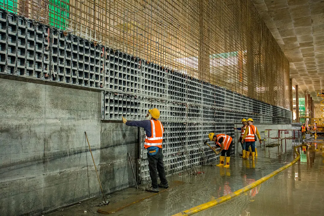 Reinforced wall formwork removal in progress at the Bandar Malaysia Selatan MRT Station site.
