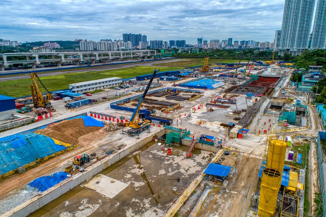 View of the Bandar Malaysia Selatan MRT Station showing the crossover roof slab water proofing works in progress and suitable backfill materials is stockpiled at site while preparing the temporary works for roof slab casting.