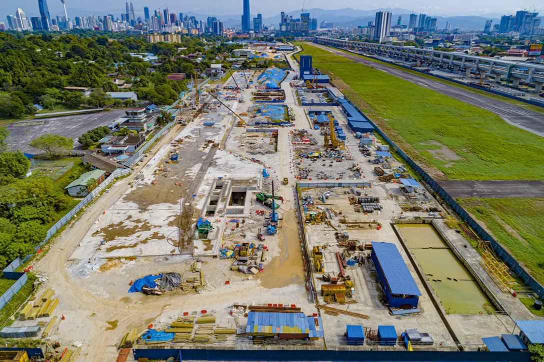 Aerial view of the Bandar Malaysia Selatan MRT Station showing the reinforced concrete works for platform and concourse level progressing well concurrently with electrical and mechanical works and architecture fitouts.