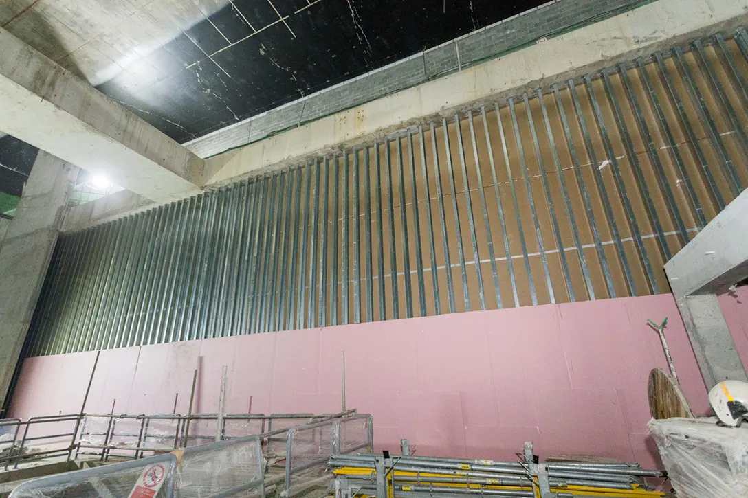 View of the Bandar Malaysia Selatan MRT Station showing drywall installation and painting works in progress at the platform level.