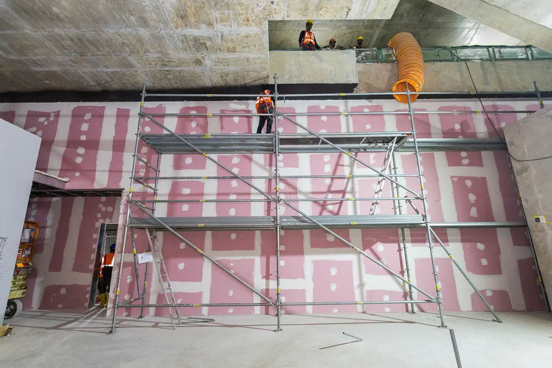 View of the Bandar Malaysia Selatan MRT Station showing the platform drywall installation works in progress.