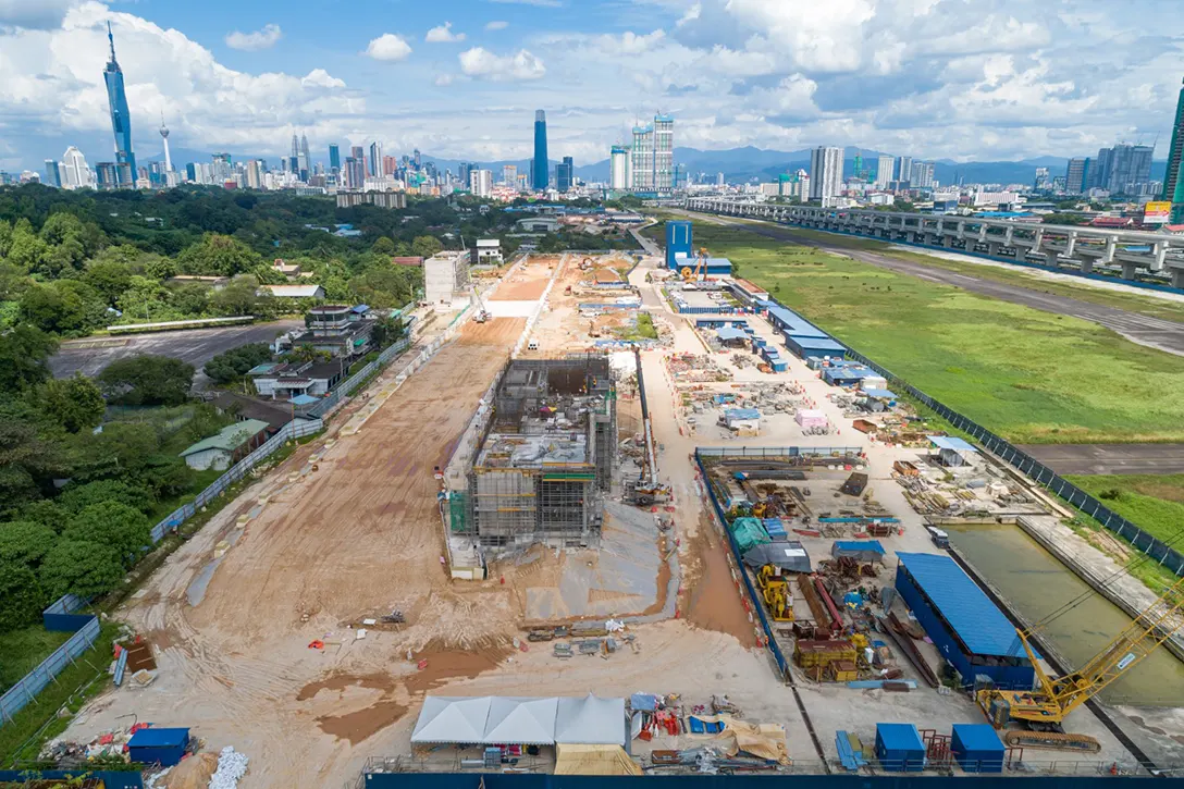 Aerial view of the Bandar Malaysia Selatan MRT Station showing backfilling works and above ground structures works in progress.