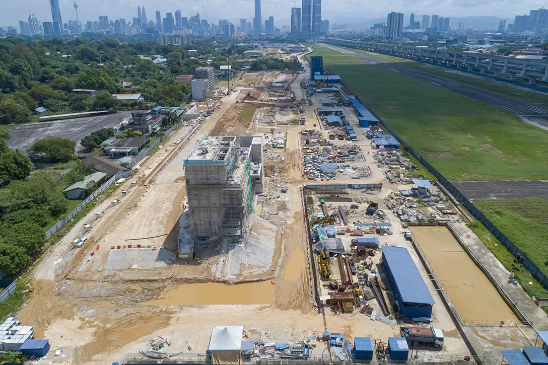 Aerial view of the Bandar Malaysia Selatan MRT Station showing the entrance structure works, backfilling and road works in progress