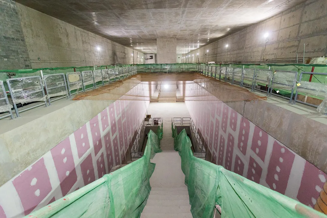 An inside view of the Bandar Malaysia Utara MRT Station showing readiness of the Front of House and completion of drywall partition at platform level.