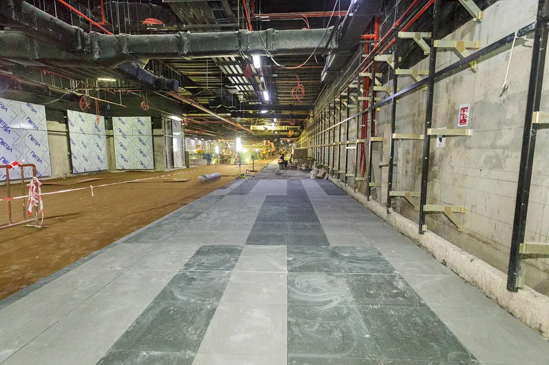 View of the Chan Sow Lin MRT Station showing the tiling works at concourse level in progress.