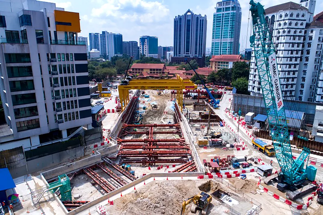 Aerial view of the Conlay MRT Station site showing strutting installation, excavation and ground anchor works.