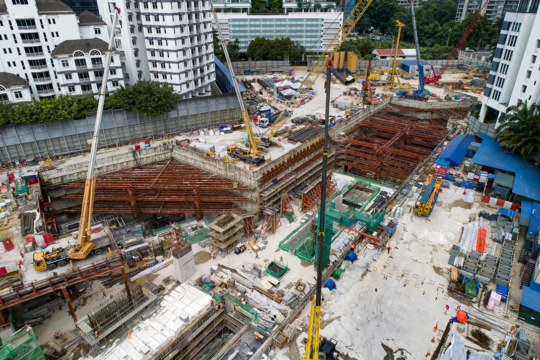 Aerial view of the Conlay MRT Station showing the reinforced concrete works, excavation works and bored pile works in progress.
