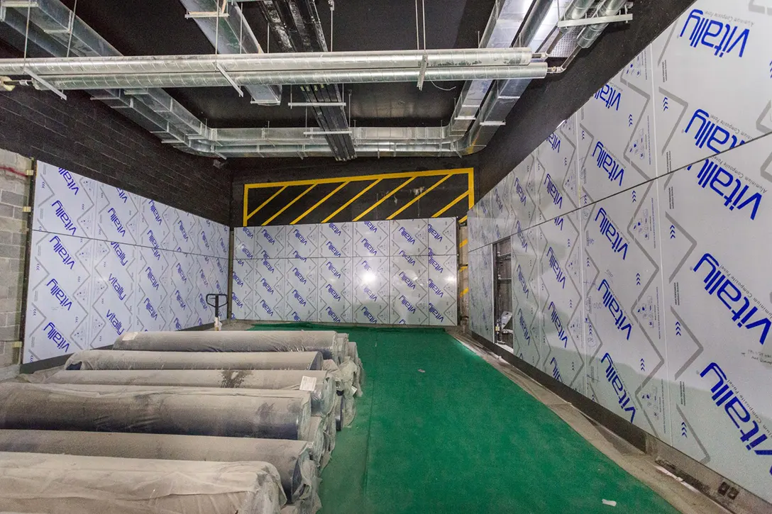 View of the Conlay MRT Station showing the cladding works at the concourse level