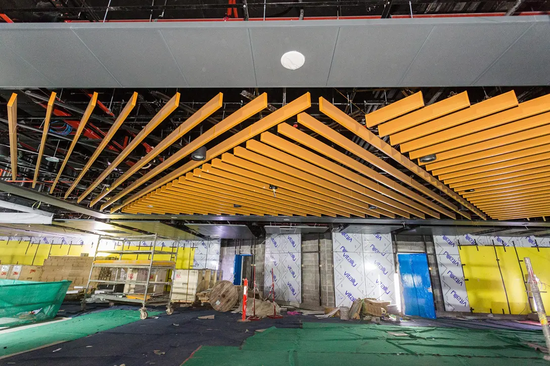 View of the Conlay MRT Station showing the installation of automatic fare collection gate in progress at the concourse level.