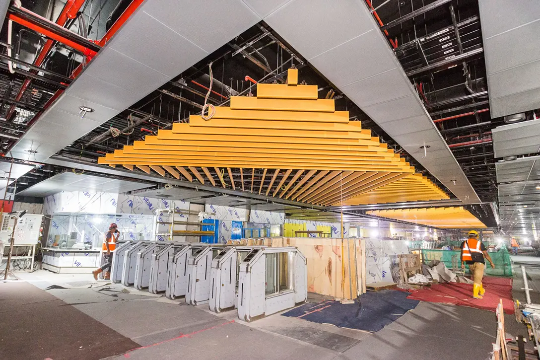 Baffle ceiling installation in progress at the Conlay MRT Station.