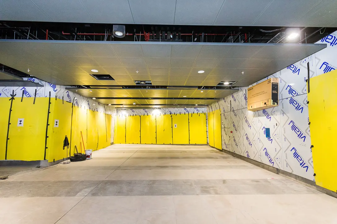 Ongoing cladding works at Conlay MRT Station concourse level.