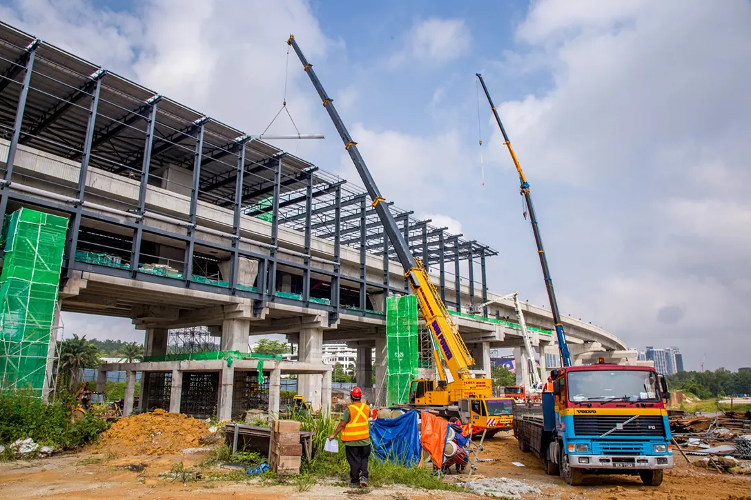 Façade steel structure installation in progress at the Cyberjaya City Centre MRT Station site.
