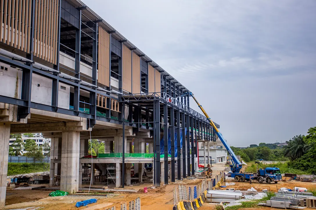 Aerial view of the Cyberjaya City Centre MRT Station site showing the entrance almost completed and façade works in progress