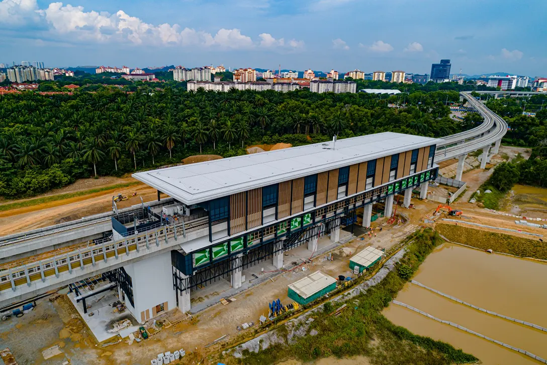 Aerial view of the Cyberjaya City Centre MRT Station showing the aluminium louvers in progress below the concourse level while drainage works and roadworks in progress.