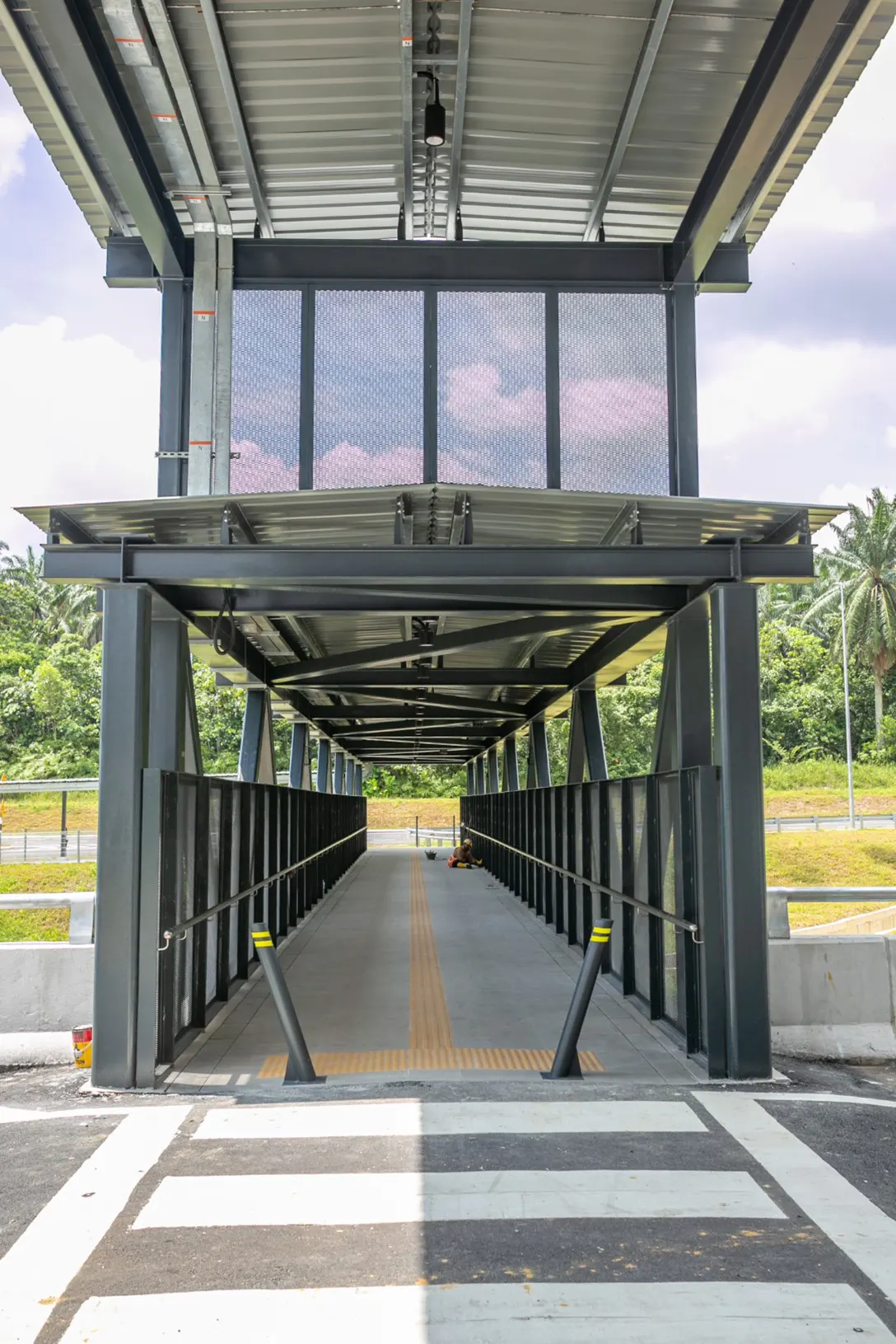 Touch-up and cleaning works at the Pedestrian Overhead Bridge in progress at the Cyberjaya City Centre MRT Station.